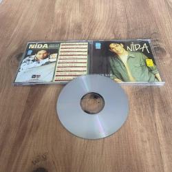 Nida - Evimizin Gelini Vurmasaydın Cd ( Dinlemeye engel olmayan kılcal çizikler vardır ) ( Dönem Cd - Sarı Bandrol )