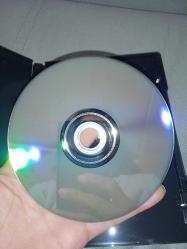 Dvd Batman the dark knight kara şövalye. İki diskli Özel Versiyon. Orijinal. Türkçe dublaj ve altyazı seçenekli. 2 disk. Disk 2 temiz. Disk 1 de çalışmasını etkilemeyen çizikler var. Sorunsuz çalışıyor