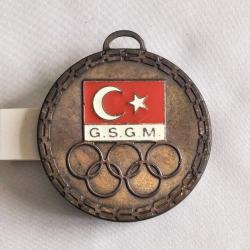 G.S.G.M. - OLİMPİYAT AMBLEMLİ BRONZ RENKLİ MİNELİ MADALYA