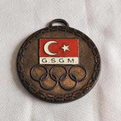 G.S.G.M. - OLİMPİYAT AMBLEMLİ BRONZ RENKLİ MİNELİ MADALYA