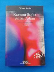 KARISINI ŞAPKA SANAN ADAM