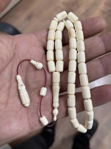 Orjinal Mahmut dişi fosilden yapılma obje fotoğrafını ekledim Mahmut  dişi fosil tespih gönderirim antika 23. 50 gram işçilik bana aittir.