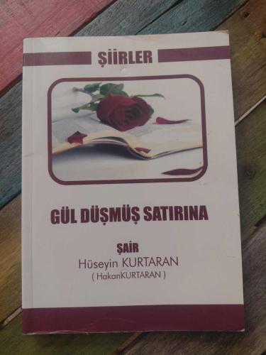 GÜL DÜŞMÜŞ SATIRINA
