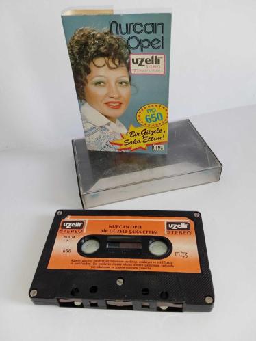 Kaset Nurcan Opel bir güzele şaka ettim albümü. Orijinal. 650 Uzelli Gema dönem Kağıt Baskı. Sorunsuz çalışıyor. Koleksiyonluk