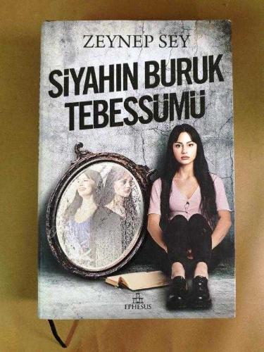 SİYAHIN BURUK TEBESSÜMÜ